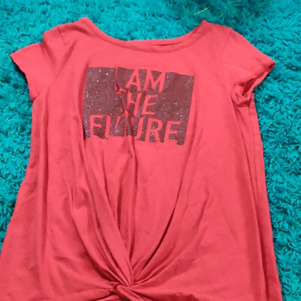 A red shirt with a tie in the stomach